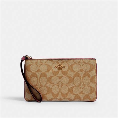 coach outlet large wristlet.